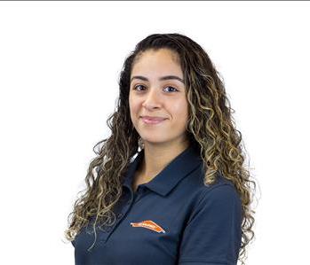 female employee with green SERVPRO background