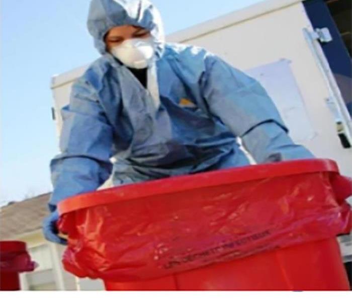 Worker Disposing BioHazardous Waste